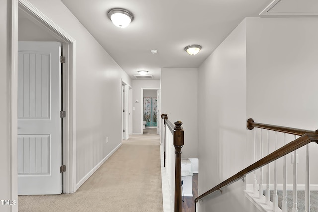 8005 Caithness St, Raleigh, NC 27616 - corridor featuring an upstairs landing, light carpet, and attic access