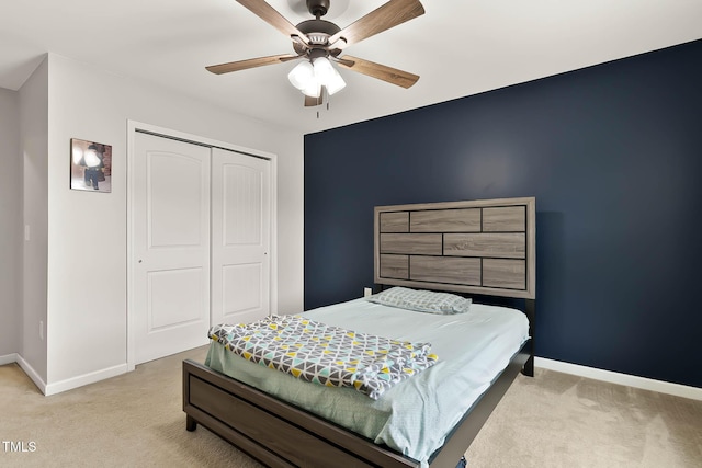 8005 Caithness St, Raleigh, NC 27616 - bedroom with light carpet, a closet, and ceiling fan