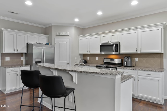 8005 Caithness St, Raleigh, NC 27616 - kitchen featuring appliances with stainless steel finishes, white cabinetry, backsplash, crown molding, and recessed lighting