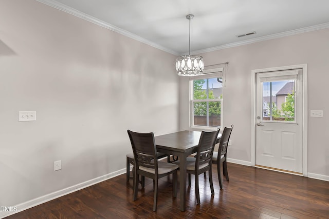 8005 Caithness St, Raleigh, NC 27616 - dining space with a chandelier, dark wood-style flooring, and crown molding