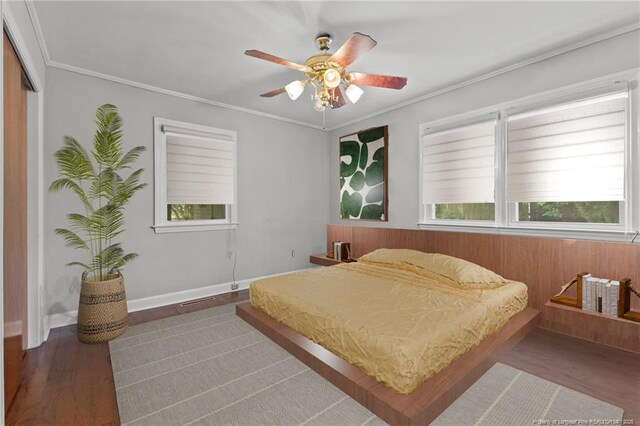 1905 Mcgougan Rd, Fayetteville, NC 28303 - bedroom featuring wood finished floors, a closet, crown molding, and ceiling fan