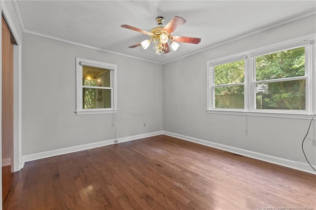 1905 Mcgougan Rd, Fayetteville, NC 28303 - unfurnished room featuring dark wood finished floors, crown molding, and ceiling fan
