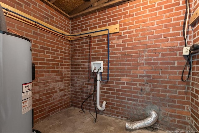 1905 Mcgougan Rd, Fayetteville, NC 28303 - laundry view of water heater, brick wall, and concrete floors