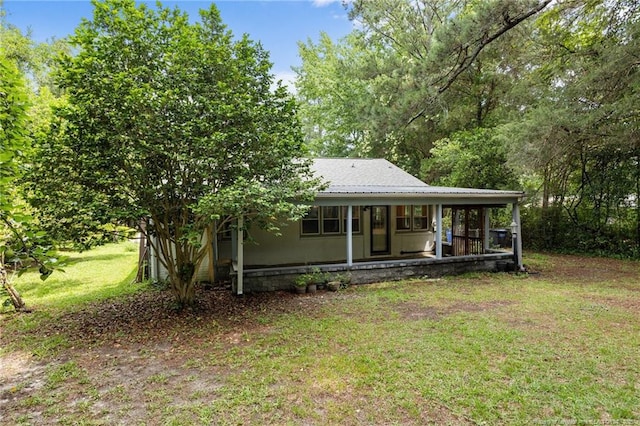 1905 Mcgougan Rd, Fayetteville, NC 28303 - back of property with a lawn and a porch