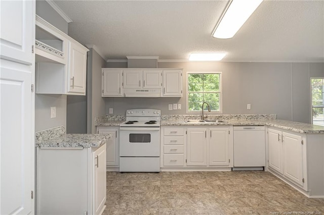 2990 Aberdeen Rd, Raeford, NC 28376 - kitchen with white appliances, exhaust hood, ornamental molding, a textured ceiling, and healthy amount of natural light