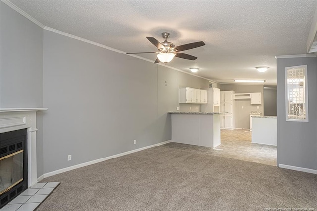 2990 Aberdeen Rd, Raeford, NC 28376 - unfurnished living room featuring ornamental molding, a textured ceiling, light carpet, a tile fireplace, and ceiling fan