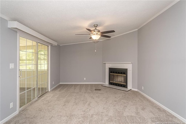 2990 Aberdeen Rd, Raeford, NC 28376 - unfurnished living room with a textured ceiling, carpet floors, ceiling fan, a glass covered fireplace, and crown molding
