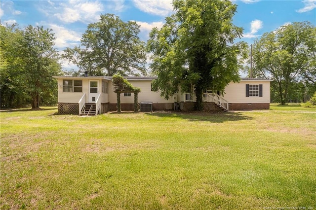 2990 Aberdeen Rd, Raeford, NC 28376 - view of green lawn featuring stairs and entry steps