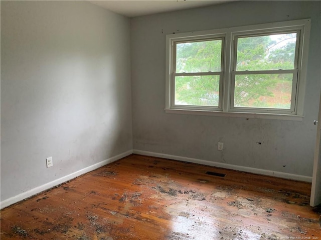 4627 Cheltenham Rd, Fayetteville, NC 28304 - empty room featuring hardwood / wood-style floors and baseboards
