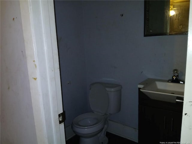 4627 Cheltenham Rd, Fayetteville, NC 28304 - half bathroom featuring vanity and toilet