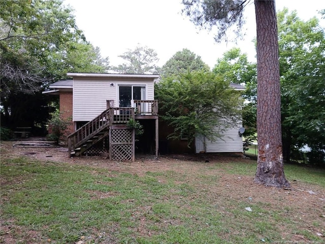 4627 Cheltenham Rd, Fayetteville, NC 28304 - back of house featuring stairway, a wooden deck, and a yard