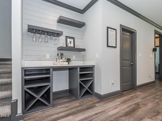 335 Glenn St, Franklinton, NC 27525 - indoor dry bar featuring crown molding, wood finished floors, and stairway