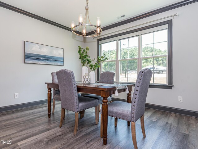 335 Glenn St, Franklinton, NC 27525 - dining space featuring a chandelier, ornamental molding, and wood finished floors