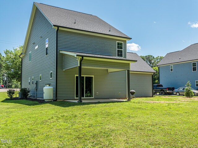 335 Glenn St, Franklinton, NC 27525 - back of house with a lawn and a patio