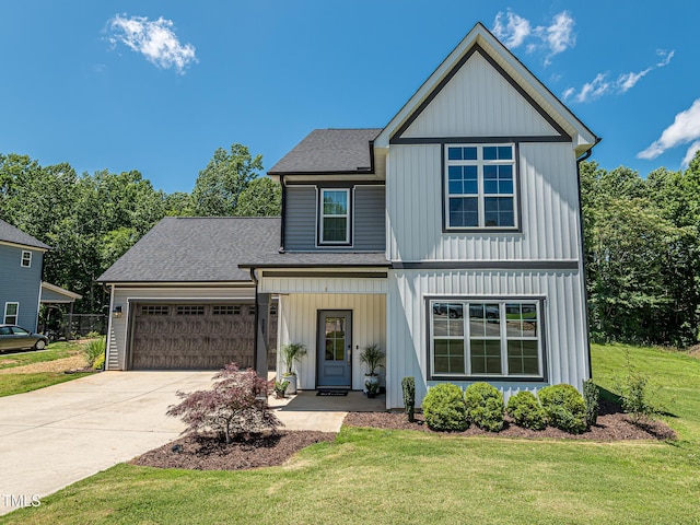 335 Glenn St, Franklinton, NC 27525 - view of front of house with an attached garage, roof with shingles, concrete driveway, and a front yard