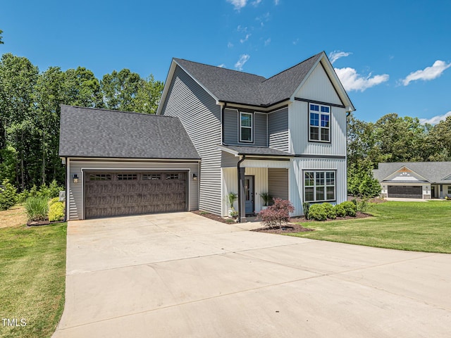 335 Glenn St, Franklinton, NC 27525 - view of front of property with a garage, concrete driveway, a front yard, and a shingled roof