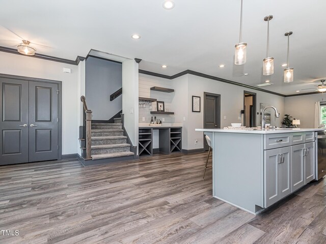335 Glenn St, Franklinton, NC 27525 - kitchen featuring ornamental molding, light countertops, recessed lighting, wood finished floors, and gray cabinetry