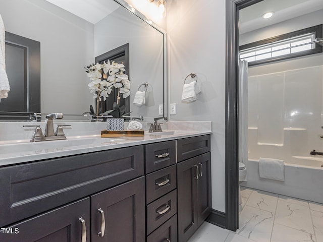 335 Glenn St, Franklinton, NC 27525 - full bathroom with double vanity, marble finish floors, and shower / tub combo