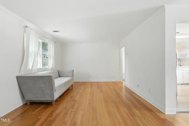 1904 Smallwood Dr, Raleigh, NC 27605 - living area with light wood finished floors and crown molding