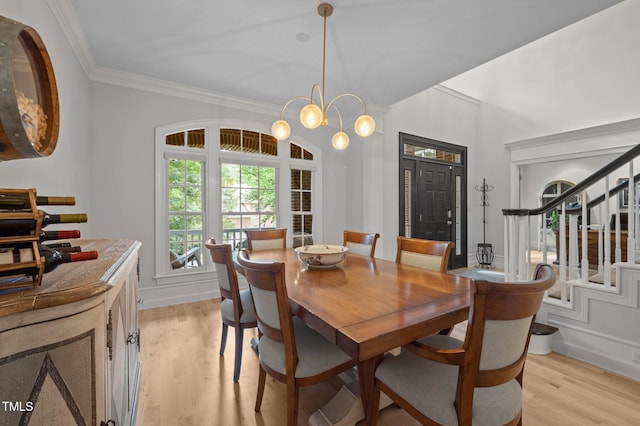 100 Redfoot Run Rd, Chapel Hill, NC 27516 - dining area featuring ornamental molding, light wood-style flooring, stairs, and a chandelier