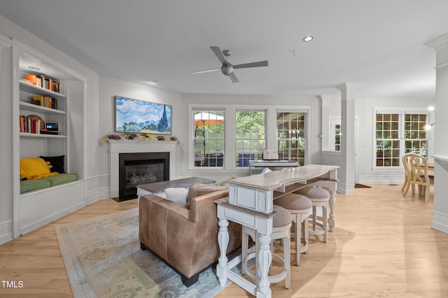 100 Redfoot Run Rd, Chapel Hill, NC 27516 - living room with ceiling fan, light wood-type flooring, a fireplace with flush hearth, built in features, and recessed lighting