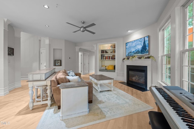 100 Redfoot Run Rd, Chapel Hill, NC 27516 - living room featuring built in features, a fireplace with flush hearth, ceiling fan, light wood-style flooring, and recessed lighting
