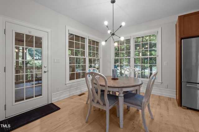 100 Redfoot Run Rd, Chapel Hill, NC 27516 - dining room featuring light wood-style flooring and a chandelier