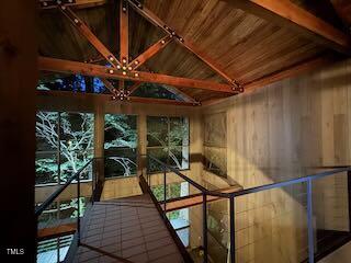 820 Runnymede Rd, Raleigh, NC 27607 - unfurnished sunroom with a chandelier and beam ceiling