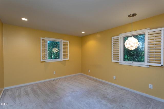 820 Runnymede Rd, Raleigh, NC 27607 - carpeted spare room featuring a chandelier and recessed lighting