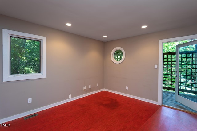 820 Runnymede Rd, Raleigh, NC 27607 - carpeted empty room featuring plenty of natural light and recessed lighting