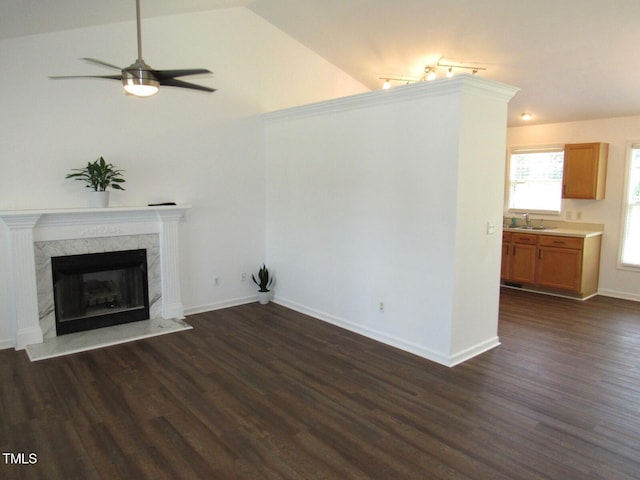 2662 Walas Ct, Creedmoor, NC 27522 - unfurnished living room featuring dark wood-style flooring, ceiling fan, lofted ceiling, and a fireplace