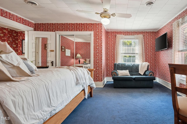 210 Peachtree St, Roxboro, NC 27573 - carpeted bedroom with wallpapered walls, crown molding, and a ceiling fan