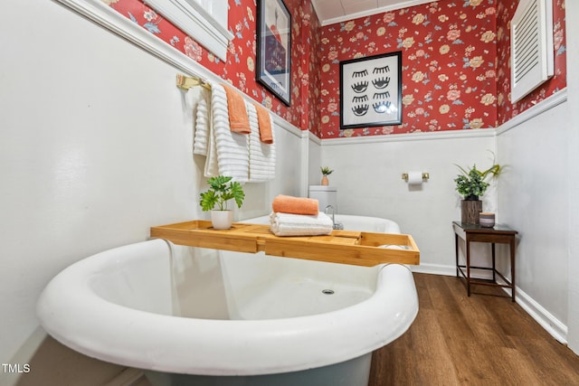 210 Peachtree St, Roxboro, NC 27573 - bathroom with wood finished floors, wallpapered walls, ornamental molding, and wainscoting