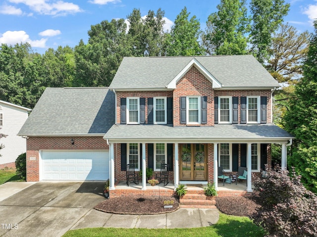 2925 Dargan Hills Dr, Wake Forest, NC 27587 - view of front of house with a porch, an attached garage, driveway, and a shingled roof