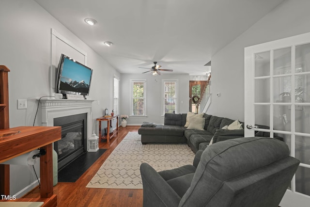 2925 Dargan Hills Dr, Wake Forest, NC 27587 - living area featuring ceiling fan, dark wood-type flooring, and a fireplace with flush hearth