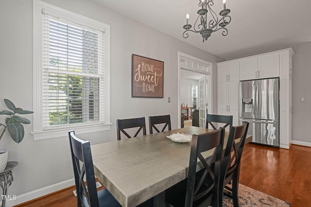 2925 Dargan Hills Dr, Wake Forest, NC 27587 - dining room with a chandelier and dark wood-style floors
