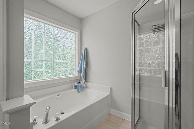 2925 Dargan Hills Dr, Wake Forest, NC 27587 - full bathroom with plenty of natural light, a garden tub, and a stall shower