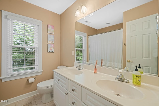 2925 Dargan Hills Dr, Wake Forest, NC 27587 - bathroom with healthy amount of natural light, double vanity, and tile patterned flooring