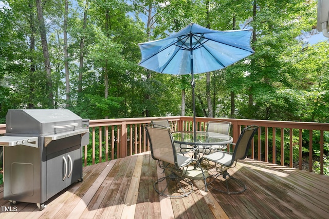 2925 Dargan Hills Dr, Wake Forest, NC 27587 - deck with outdoor dining space, a grill, and view of scattered trees