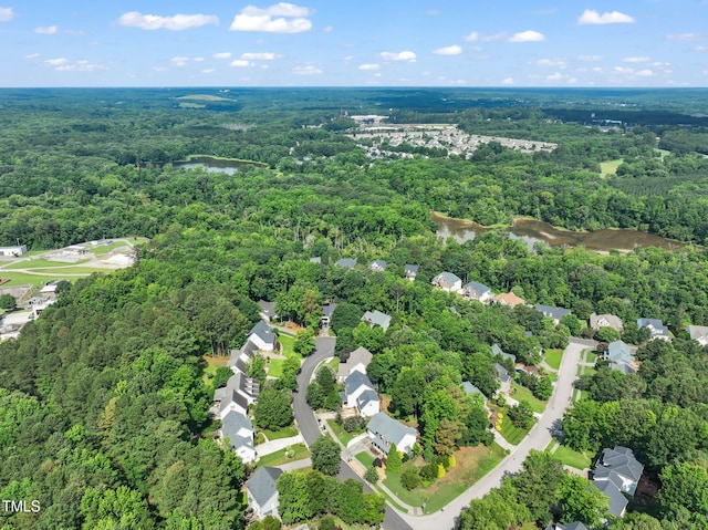 2925 Dargan Hills Dr, Wake Forest, NC 27587 - aerial perspective of suburban area featuring a heavily wooded area and a nearby body of water