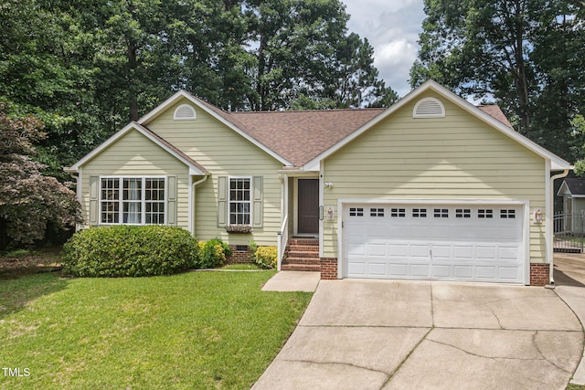 6205 Houndsman Ct, Raleigh, NC 27616 - ranch-style home featuring driveway, a front lawn, a garage, and a shingled roof