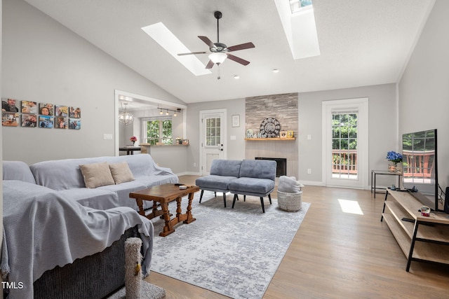 6205 Houndsman Ct, Raleigh, NC 27616 - living area with a skylight, healthy amount of natural light, a ceiling fan, and high vaulted ceiling