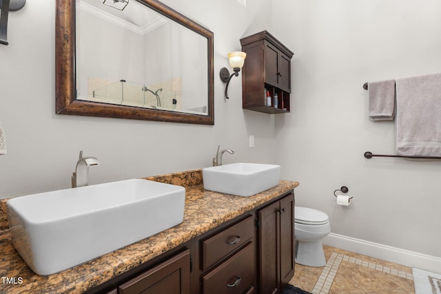 6205 Houndsman Ct, Raleigh, NC 27616 - full bathroom featuring double vanity, ornamental molding, and tile patterned flooring