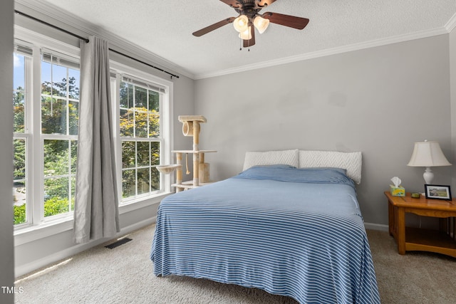 6205 Houndsman Ct, Raleigh, NC 27616 - carpeted bedroom featuring ornamental molding, a textured ceiling, and a ceiling fan