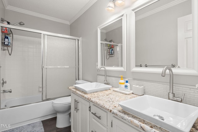 6205 Houndsman Ct, Raleigh, NC 27616 - bathroom with double vanity, ornamental molding, combined bath / shower with glass door, wood finished floors, and tasteful backsplash