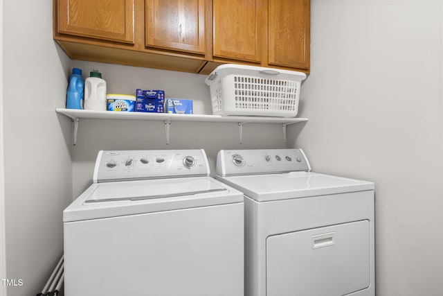 6205 Houndsman Ct, Raleigh, NC 27616 - laundry area featuring washer and clothes dryer and cabinet space