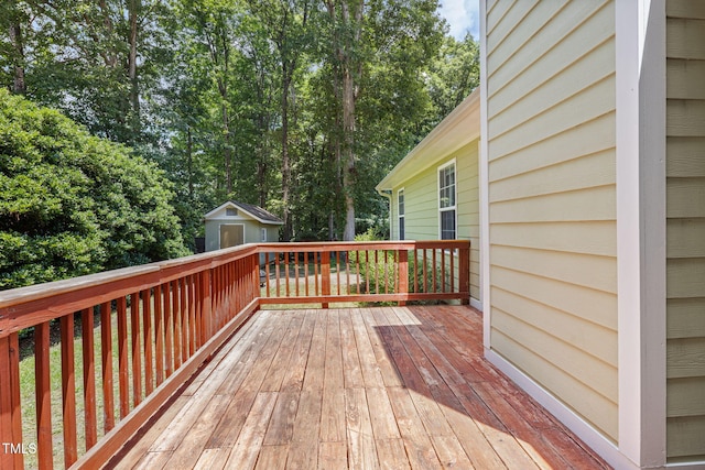 6205 Houndsman Ct, Raleigh, NC 27616 - deck featuring a storage shed and view of wooded area