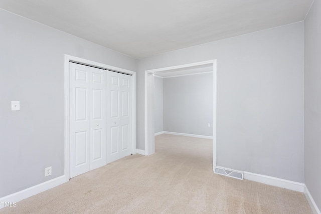 2801 E Shoreham St, Durham, NC 27707 - unfurnished bedroom featuring carpet floors and a closet