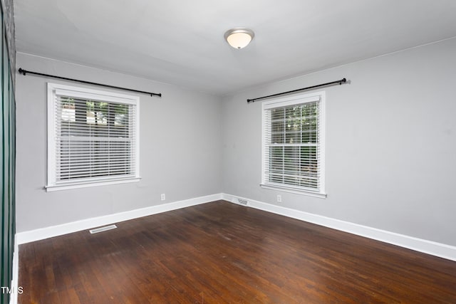 2801 E Shoreham St, Durham, NC 27707 - empty room featuring baseboards and dark wood finished floors