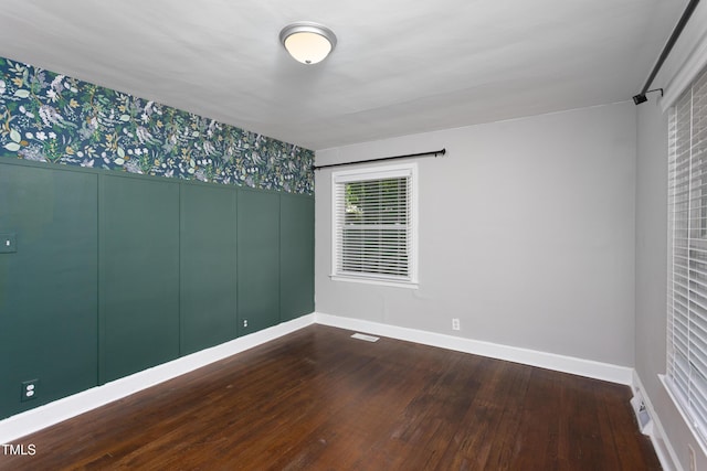 2801 E Shoreham St, Durham, NC 27707 - unfurnished room featuring wallpapered walls and dark wood finished floors